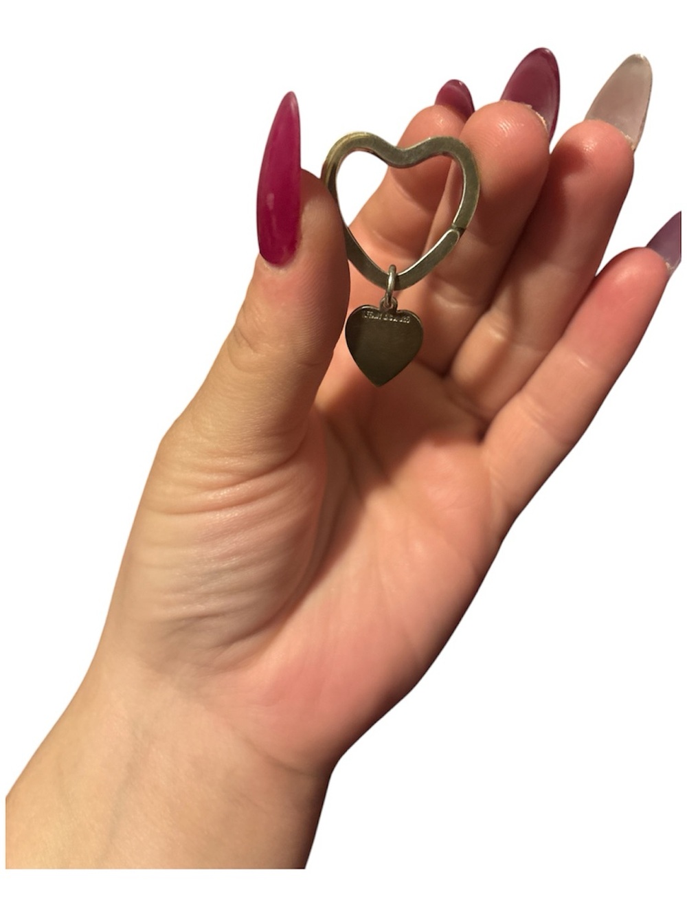 Tiffany & Co. sterling silver heart-shaped key ring with a dangling heart charm